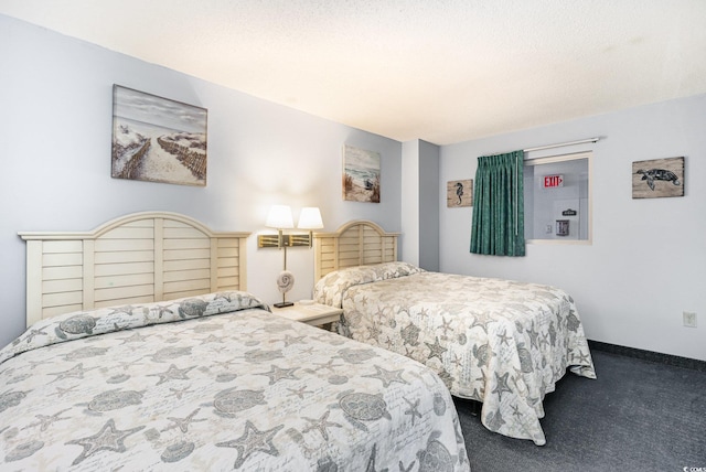 bedroom featuring carpet floors and baseboards