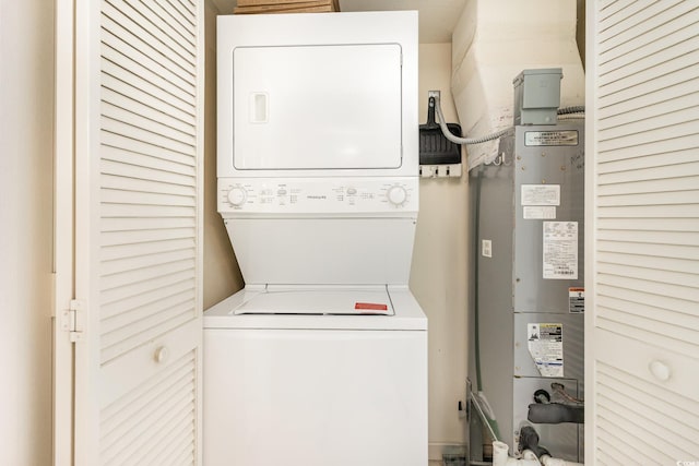 washroom with laundry area and stacked washing maching and dryer