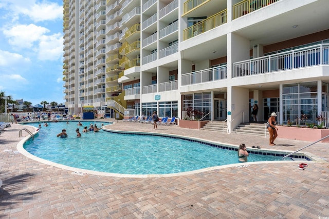 community pool with a patio