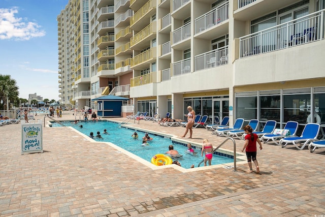 pool with a patio area