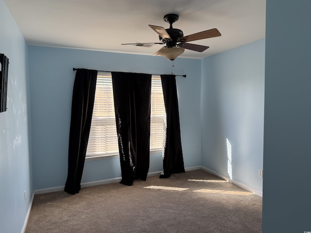 empty room with light carpet and ceiling fan