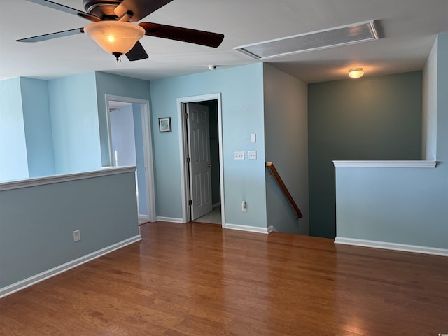 spare room featuring hardwood / wood-style flooring and ceiling fan