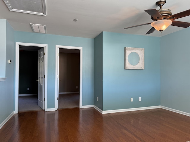 spare room featuring ceiling fan and dark hardwood / wood-style flooring