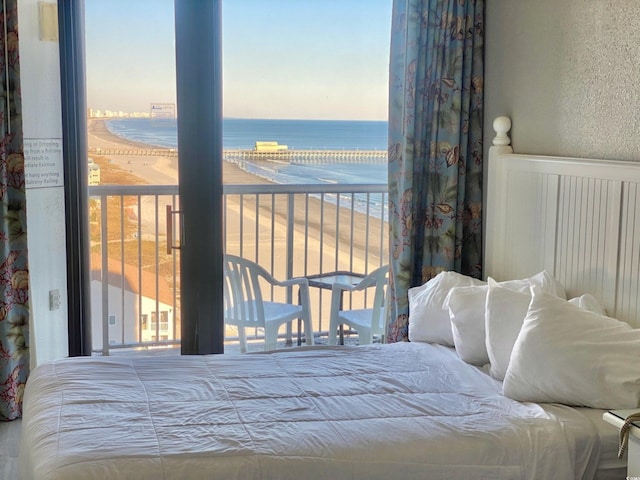 9550 Shore Dr Unit 1226, Myrtle Beach, SC 29572 - bedroom with a water view and a textured wall