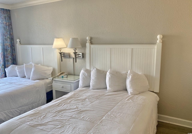 9550 Shore Dr Unit 1226, Myrtle Beach, SC 29572 - bedroom with a textured wall, baseboards, and wood finished floors