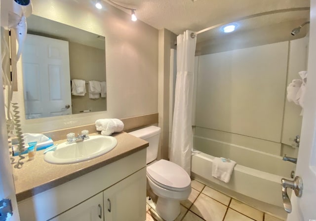 9550 Shore Dr Unit 1226, Myrtle Beach, SC 29572 - bathroom with toilet, shower / tub combo, tile patterned floors, a textured ceiling, and vanity