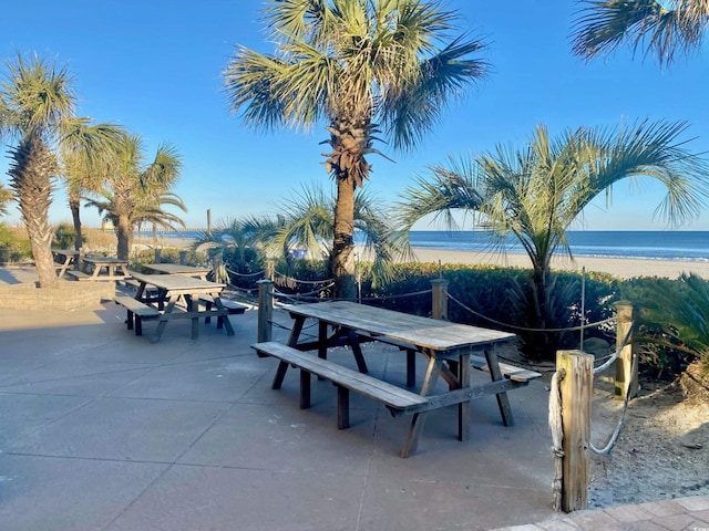 9550 Shore Dr Unit 1226, Myrtle Beach, SC 29572 - surrounding community with outdoor dining area, a water view, and a patio area