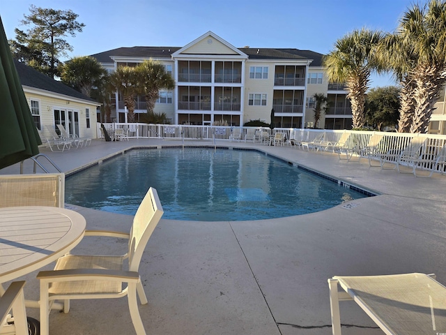 view of swimming pool with a patio