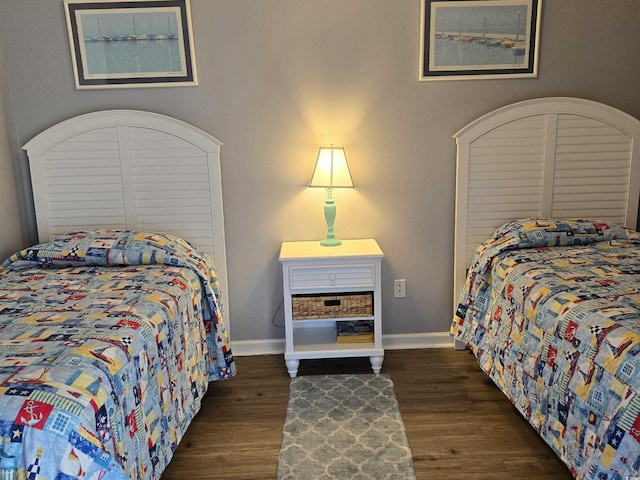 bedroom featuring dark hardwood / wood-style flooring