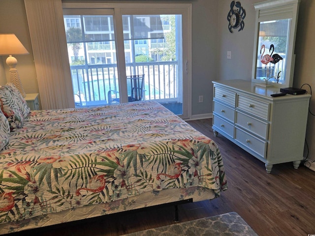 bedroom with dark hardwood / wood-style floors and access to outside