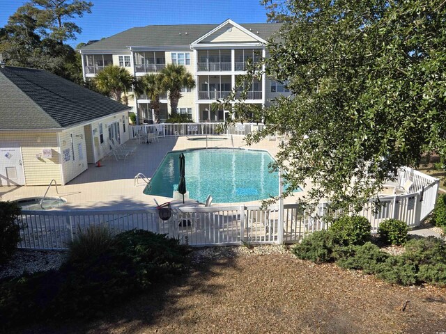 view of swimming pool featuring a patio area