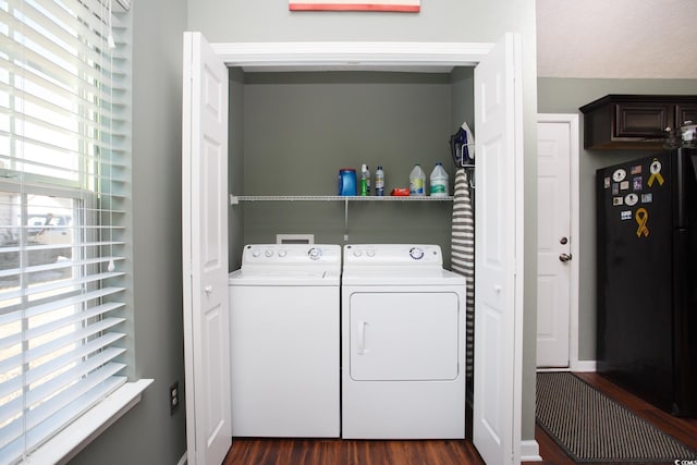 laundry room featuring laundry area, dark wood-style flooring, and washing machine and clothes dryer