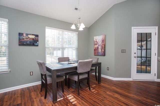 dining room with baseboards, a chandelier, dark wood finished floors, and vaulted ceiling