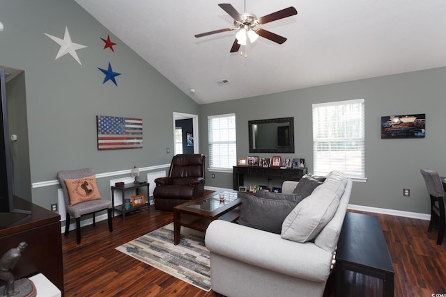 living area with visible vents, high vaulted ceiling, dark wood-type flooring, a ceiling fan, and baseboards