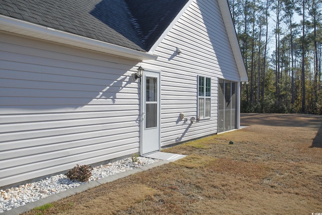 view of property exterior featuring roof with shingles