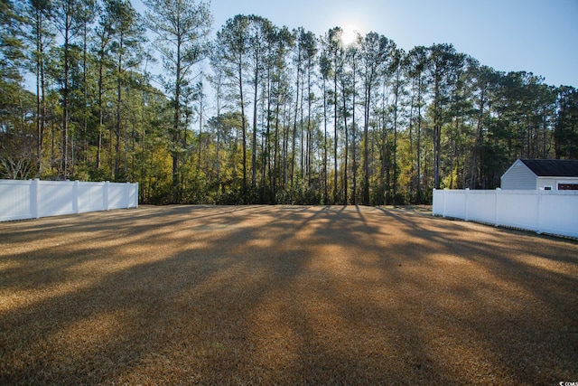 view of yard with fence