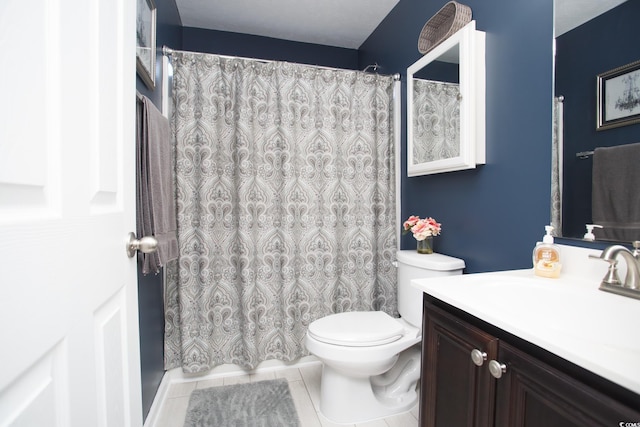 bathroom with tile patterned floors, a shower with shower curtain, toilet, and vanity