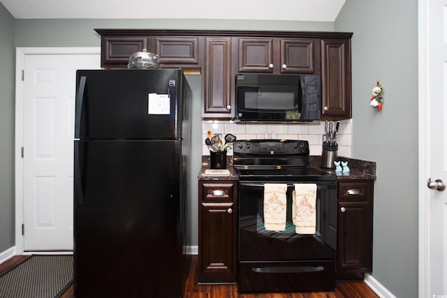 kitchen with tasteful backsplash, dark brown cabinets, baseboards, black appliances, and dark wood-style flooring