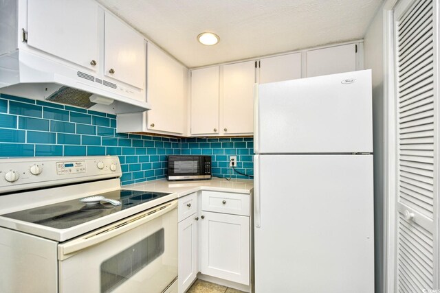 kitchen featuring white cabinetry, backsplash, and white appliances