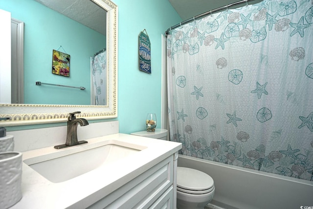 full bathroom featuring vanity, shower / bath combination with curtain, and toilet