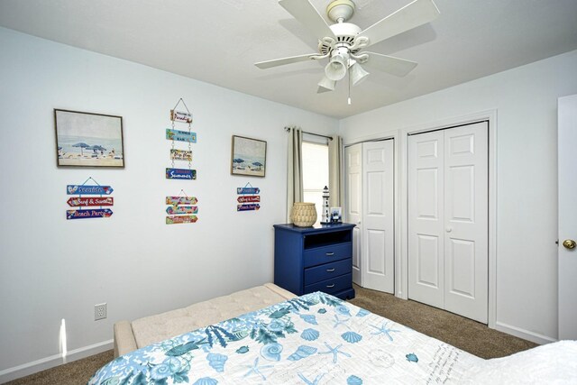 carpeted bedroom featuring two closets and ceiling fan