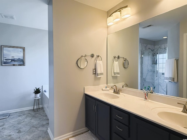 bathroom featuring vanity and separate shower and tub