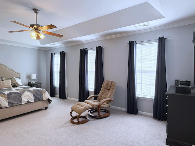 bedroom with light carpet, ornamental molding, multiple windows, and baseboards