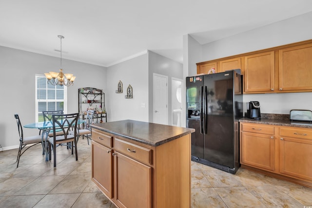 kitchen featuring black fridge with ice dispenser, a chandelier, brown cabinetry, a kitchen island, and crown molding