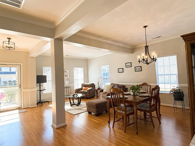 interior space with dark brown cabinets, crown molding, and light hardwood / wood-style flooring