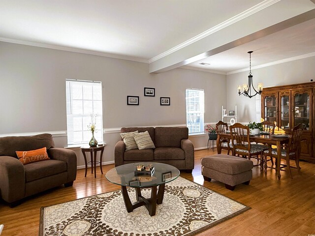 living room featuring crown molding and light hardwood / wood-style flooring