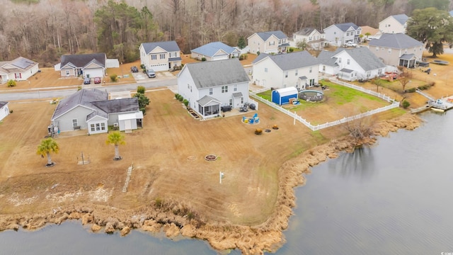 bird's eye view with a water view and a residential view