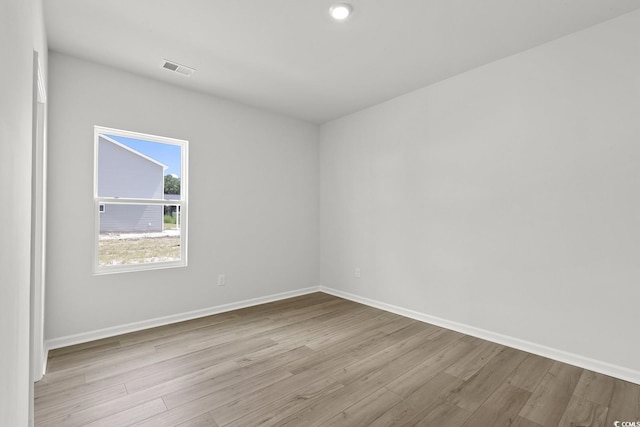 spare room with light hardwood / wood-style flooring