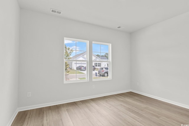 unfurnished room featuring light wood-type flooring