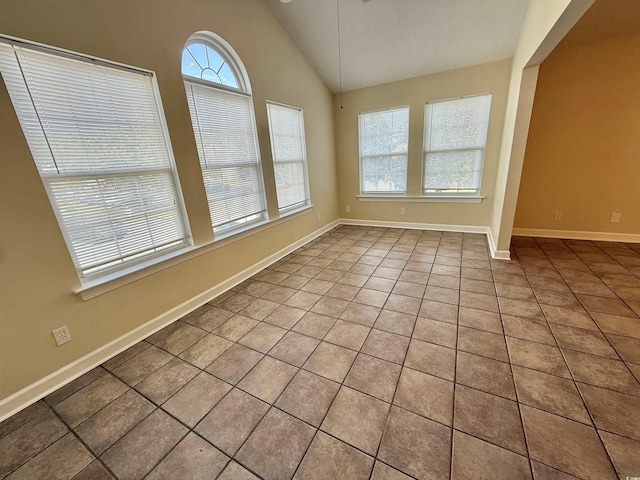 4273 Santolina Way Unit E, Murrells Inlet, SC 29576 - empty room featuring tile patterned floors, lofted ceiling, and baseboards