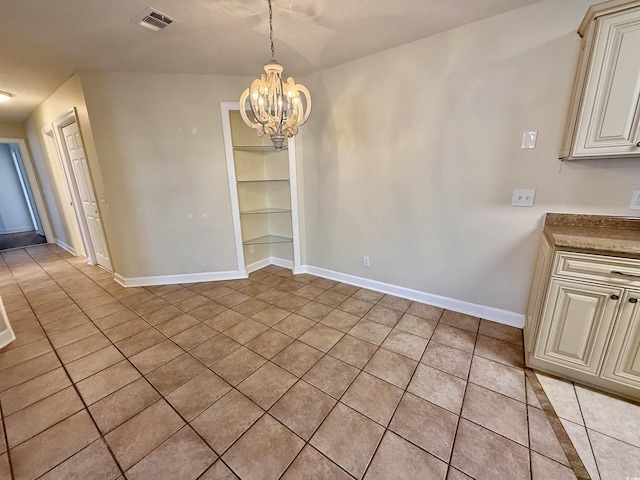 4273 Santolina Way Unit E, Murrells Inlet, SC 29576 - unfurnished dining area with light tile patterned floors, a chandelier, and baseboards