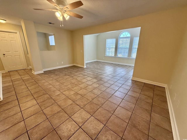 4273 Santolina Way Unit E, Murrells Inlet, SC 29576 - spare room featuring light tile patterned floors, ceiling fan, and baseboards