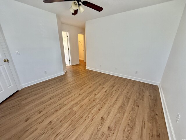 4273 Santolina Way Unit E, Murrells Inlet, SC 29576 - unfurnished bedroom featuring wood finished floors, baseboards, and a ceiling fan