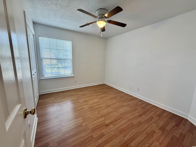 4273 Santolina Way Unit E, Murrells Inlet, SC 29576 - unfurnished room featuring wood finished floors, a ceiling fan, and baseboards