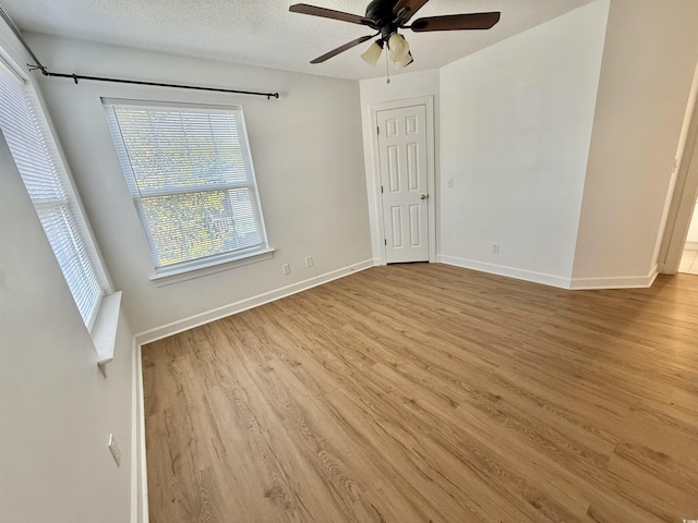 4273 Santolina Way Unit E, Murrells Inlet, SC 29576 - empty room featuring wood finished floors, a ceiling fan, baseboards, and a textured ceiling