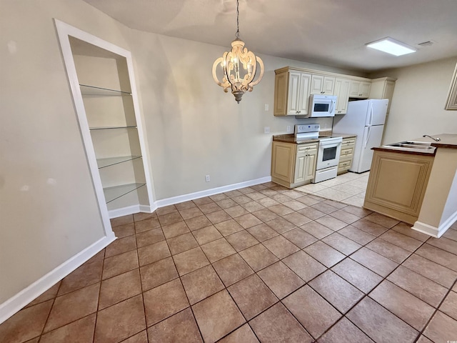 4273 Santolina Way Unit E, Murrells Inlet, SC 29576 - kitchen featuring white appliances, a sink, a chandelier, light tile patterned flooring, and built in shelves