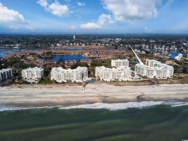 aerial view with a view of the beach and a water view