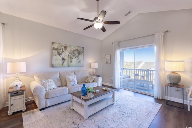 living area featuring wood finished floors, baseboards, visible vents, lofted ceiling, and ceiling fan