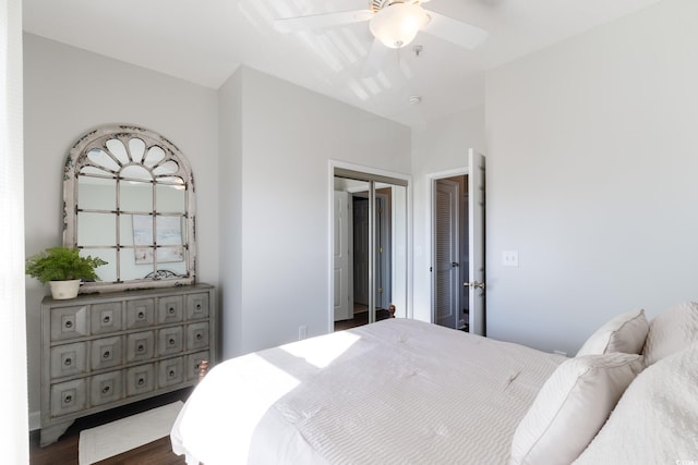 bedroom with dark wood finished floors and a ceiling fan