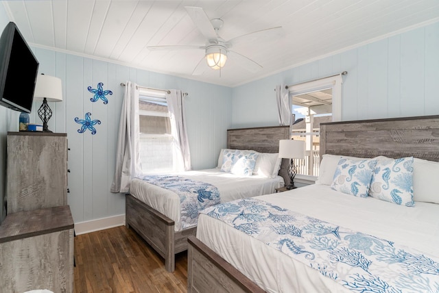 bedroom with dark wood-type flooring, ornamental molding, wooden ceiling, and ceiling fan