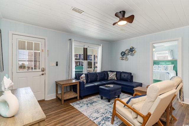 living room with ceiling fan, dark hardwood / wood-style flooring, crown molding, and wood ceiling