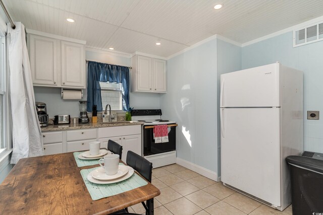 kitchen with ornamental molding, sink, white cabinets, and white appliances