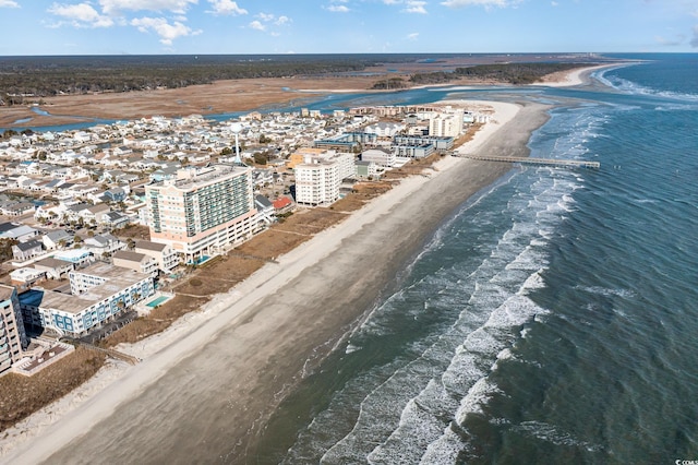 birds eye view of property with a beach view and a water view