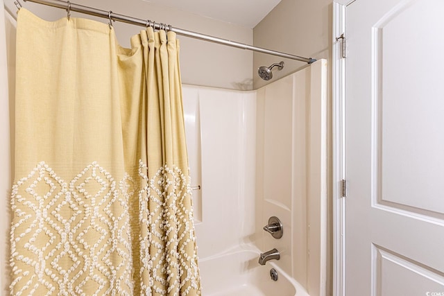 bathroom with shower / bathtub combination with curtain