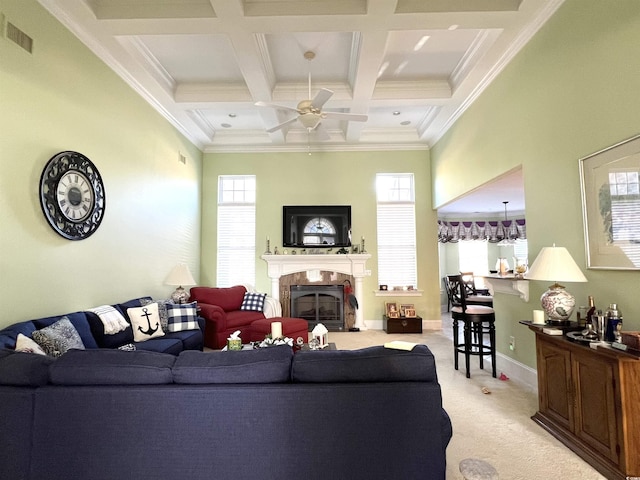 carpeted living room featuring ceiling fan, crown molding, beamed ceiling, and coffered ceiling