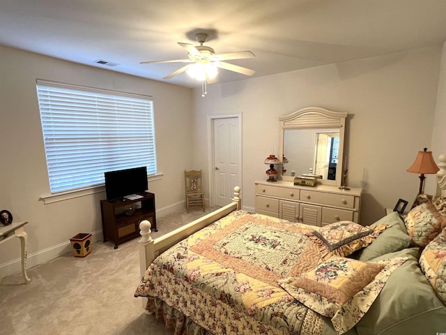 carpeted bedroom with ceiling fan